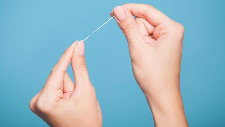 Hands with floss | Narre Warren Dentist