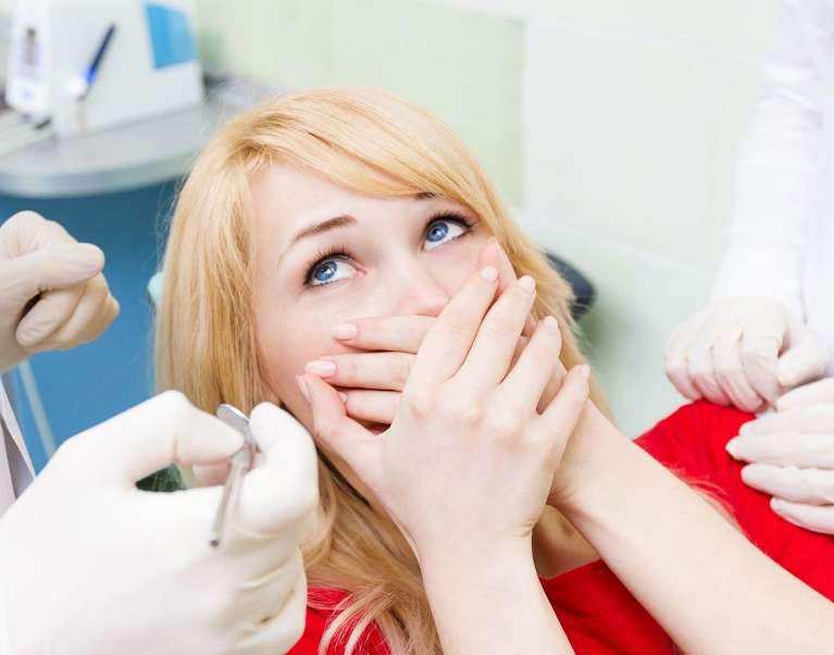 woman afraid at the dentist | Narre Warren