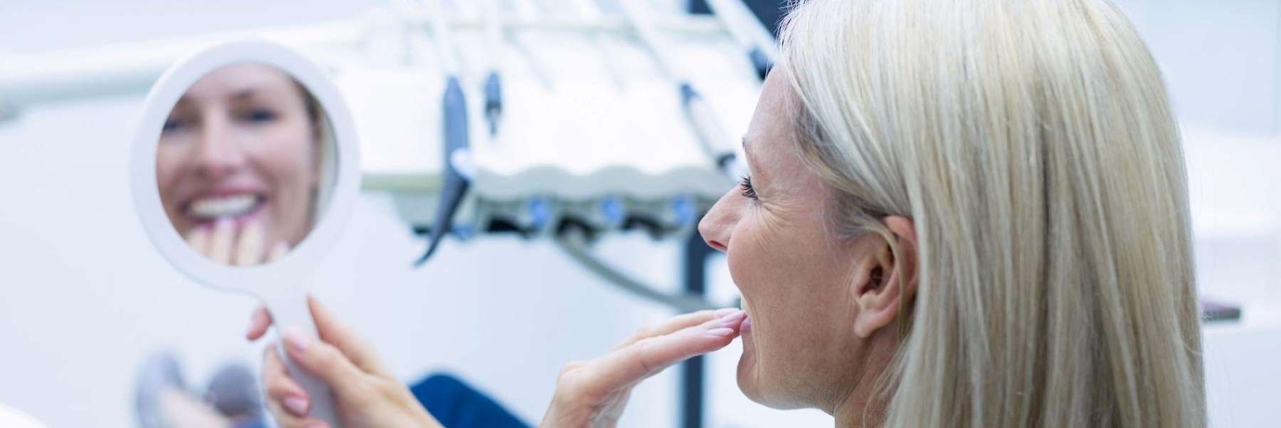 woman at the dentist looking at teeth | Narre Warren