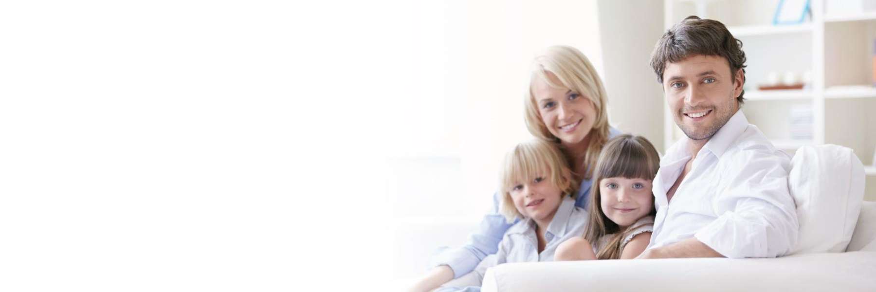 family of four hugging | dentist near me