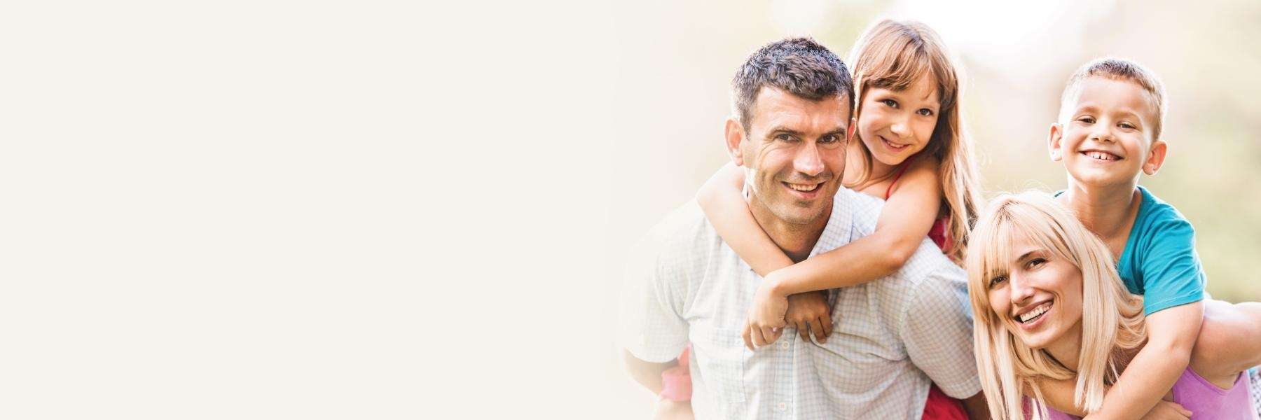 family of four hugging | dentist narre warren